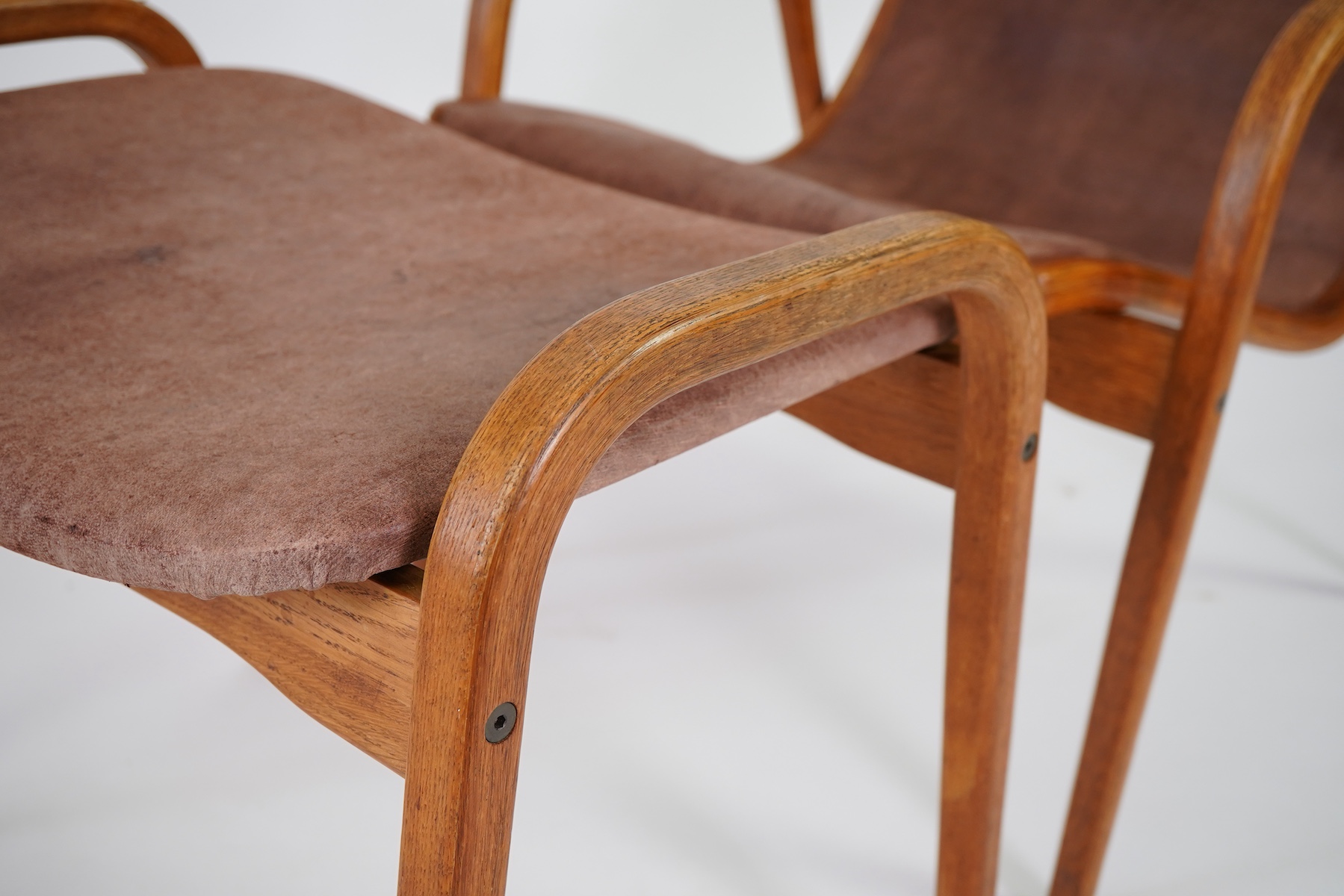 Yngve Ekström (Swedish, 1913-1998) for Swedese Möbler AB: A 'Lamino' oak lounge chair and ottoman